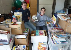 Nick and Michael Camarda sorting donated books